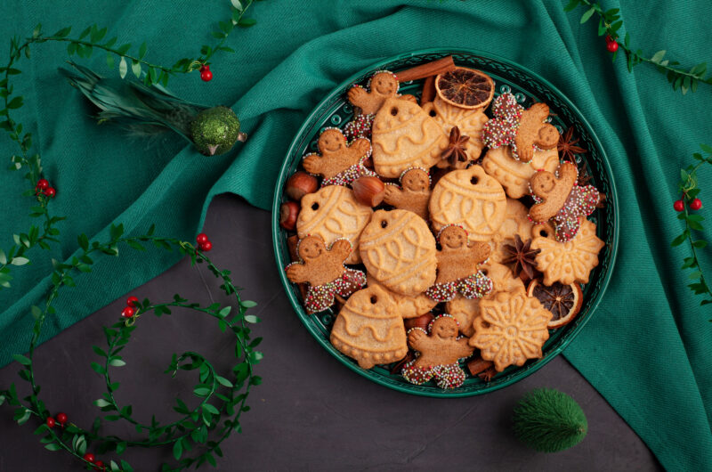 Tasty homemade Christmas cookies in the green plate.