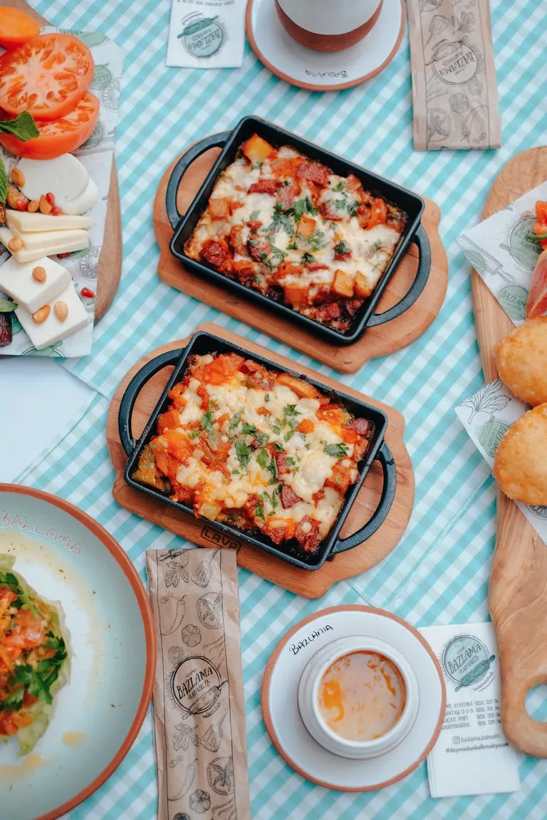 A delightful arrangement of casseroles and coffee on a blue checkered tablecloth, i