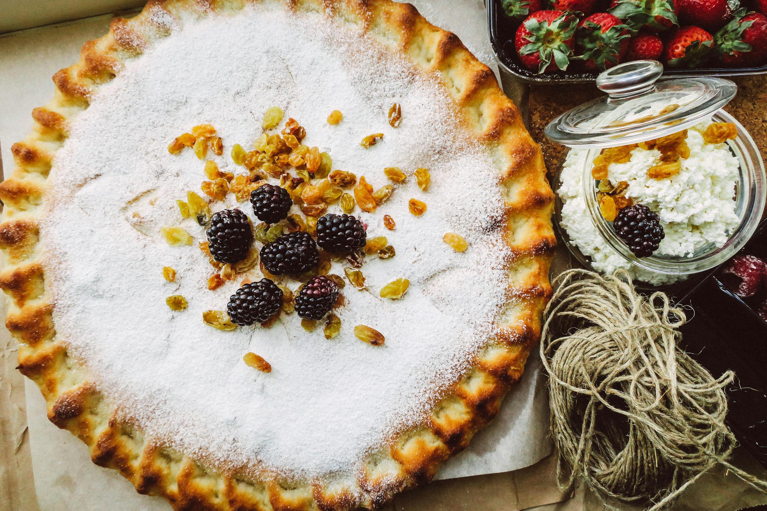 A savory tart with blackberries, raisins, and cottage cheese, perfect for dessert lovers.